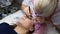 Professional beautician undergoing eyelash extension procedure. Master and a client in a modern beauty salon