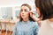 Professional beautician work with woman eyes