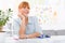 Professional beautiful young woman sitting her desk at her home