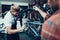 Professional Bike Repairman Fix Cycle in Workshop