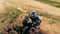 Professional biker with his autobike standing on a hill.