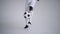 A professional black football player in a white uniform on a white background juggles a ball in slow motion. African