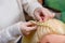 Professional braiding of braids by a master hairdresser in a beauty salon.