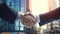 Professional Businessman Handshake in Front of Buildings - Closeup Daylight