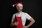 Professional butcher or fishmonger in white t shirt and classic apron and Christmas hat. The model is male in his 40s, slim body