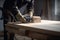 professional carpenter, sawing and sanding wooden board, close-up