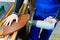 Professional carpenter at work dries a tree by a professional industrial hair dryer hand tool close-up of a carpentry