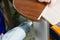 Professional carpenter at work dries a tree by a professional industrial hair dryer hand tool close-up of a carpentry