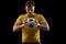 Professional caucasian football soccer player standing isolated on black studio background.