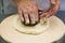 Professional chef prepares a closed meat pie