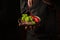 A professional chef sprinkles salt on a sliced beef steak and vegetables in a plate. The concept of serving dishes to order