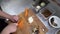 Professional chefs in the restaurant or in the kitchen of the hotel, the chef cuts carrots on a wooden board, top view