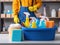 A professional cleaner in uniform coveralls with a bucket and assortment of cleaning products