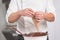 Professional confectioner making chocolate sweets at confectionery shop.