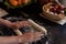 Professional cook making mushroom pastries in a kitchen