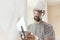 Professional craftsman applying plaster with a trowel