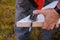 Professional cutting tool jigsaw, cut wooden sawing plank close up hand of woodworker with sawdust