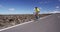 Professional cyclist riding racing bike in race competition on open road