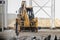 Professional demolition of reinforced concrete structures with an industrial hydraulic hammer with an excavator. Dismantling the