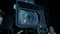 Professional digital cinema camera with set of light hanging in studio background. Close up