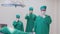 Professional doctors team, specialist surgeons in uniforms in hospital\\\'s ICU.