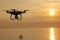 Professional drone quad copter with digital camera at sunset ready to fly for surveillance. close-up of Rotor UAV. four