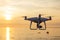 Professional drone quad copter with digital camera at sunset ready to fly for surveillance. close-up of Rotor UAV. four