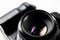 Professional dslr camera equipment with 50 mm f1.8 prime lens objective camera lens in macro close-up view shows details of photog