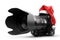 Professional DSLR Camera with zoom lens under red Christmas hat. 3D Rendering