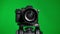 Professional DSLR photo camera with lens at green background. Chroma key.