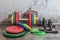Professional dumbbells, multi-colored weight plates, jump rope and push-up stops on a vintage background. Sports equipment.
