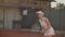 Professional equipped female beating hard the tennis ball with tennis racquet. Professional equipped female beating hard