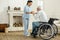 Professional experienced caregiver looking after her patient