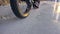 Professional extreme sportsman biker riding fat bike in outdoor. Close-up view of rear wheel. Cyclist ride in winter