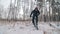 Professional extreme sportsman biker riding a fat bike in outdoors. Cyclist ride in the winter snow forest. Man does