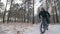 Professional extreme sportsman biker riding a fat bike in outdoors. Cyclist ride in the winter snow forest. Man does