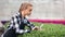 Professional female agricultural farmer pouring fertilizer for growing plants seedling