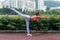 Professional female athlete practicing yoga horizontal balancing stick pose standing on one leg keeping balance in