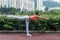 Professional female athlete practicing yoga horizontal balancing stick pose standing on one leg keeping balance in