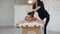 Professional female masseur making relaxing massage in spa salon.