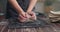 Professional female potter preparing kneading clay for work. Pottery workshop studio. Slow motion