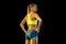 Professional female relay racer training on black studio background in neon light