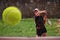 A professional female tennis player serves the tennis ball on the court with precision and power