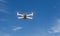 Professional filming drone flies in the air at a low altitude against a blue sky. Drone makes photos. Modern new technology. Ready