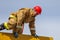 A professional fireman in a special suit jumps over a barrier .Regional fire-fighting in the training area with urban and