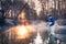 Professional fishing. Fisherman in professional wear standing in river.