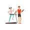 Professional fitness coach and young woman running on thread mill, people exercising under control of personal trainer