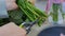 Professional florist cutting flower stems at flower store