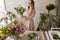 Professional florist decorator in flower shop