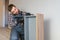 Professional Furniture Assembly Worker Assembles Shelf. Professional Handyman Doing Assembly Job Well